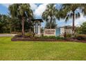 Lakeshore Preserve community entrance with landscaping and signage at 17860 Althea Blue Pl, Lutz, FL 33558