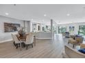 Open concept dining room with a modern table and chairs at 12404 Capri N Cir # 0, Treasure Island, FL 33706