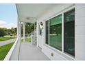 Bright condo balcony with a view of the surrounding landscape at 2430 Brazilia Dr # 24, Clearwater, FL 33763