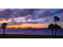 Stunning sunset view over the water with city skyline in the distance at 50 Coe Rd # 125, Belleair, FL 33756