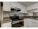 Updated kitchen with stainless steel appliances and gray tile backsplash at 106 Pine Ct # 106, Oldsmar, FL 34677