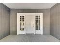 White front door with glass panels, welcoming entryway at 907 E North Bay St, Tampa, FL 33603