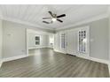 Spacious living room with hardwood floors and ceiling fan at 907 E North Bay St, Tampa, FL 33603