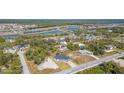 Areal view of a home in a serene neighborhood with ponds and lush greenery throughout the community at 14346 San Domingo Blvd, Port Charlotte, FL 33981