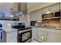 Modern kitchen with stainless steel appliances, granite countertops, stylish cabinets, and tile backsplash at 5820 43Rd N Ter # 1406, St Petersburg, FL 33709