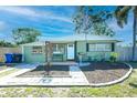 Inviting single-story home with a cozy front porch and neatly landscaped yard at 7226 13Th N St, St Petersburg, FL 33702
