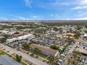 Expansive aerial view of a real estate building and parking with city views on the horizon at 2353 Shelley St # 21, Clearwater, FL 33765
