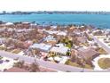 This coastal home offers stunning views of the water, a nearby beach, and city skyline at 855 Boca Ciega Isle Dr, St Pete Beach, FL 33706