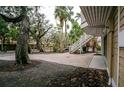 Paver driveway with plenty of parking surrounded by beautiful trees at 5169 Oxford Dr, Sarasota, FL 34242