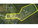 Aerial view of a sprawling property showcasing the home's secluded, wooded lot at 11933 Pasco Trails Blvd, Spring Hill, FL 34610