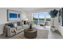 Bright living room with water view and modern furnishings at 8150 Brent St # 734, Port Richey, FL 34668