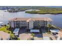 Waterfront building with parking and lush landscaping at 8150 Brent St # 734, Port Richey, FL 34668