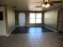Living room with tile flooring and access to other rooms at 7410 Mayfield Dr, Port Richey, FL 34668