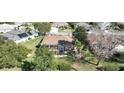 Home with a screened-in pool and spacious backyard at 3473 Conifer Loop, Spring Hill, FL 34609