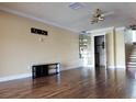 A bright, spacious living room featuring wood floors, ready for a comfortable and inviting home at 1873 Mazo Mnr # T5, Lutz, FL 33558