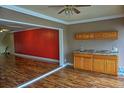 Wet bar with wood cabinets and granite countertops at 1873 Mazo Mnr # T5, Lutz, FL 33558