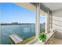 Stunning water view from a living space with a pier at 770 Island Way # N302, Clearwater, FL 33767