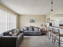 Living room with gray couches and wood floors at 11935 Bayonet Ln # 0, New Port Richey, FL 34654