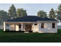 Back view of a single story home with covered patio at 4101 Valley Brook Ct, Spring Hill, FL 34606