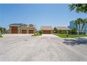 Houses with three-car garages and manicured lawns at 3154 Brigantine Ct, New Port Richey, FL 34652