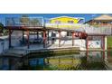 Multi-level waterfront deck with seating area and private boat dock at 4040 Hermosa Blvd, Hernando Beach, FL 34607