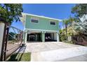 Two-story home offering ground-level parking and storage at 6629 Harbor Dr, Hudson, FL 34667