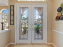 Double front doors with beveled glass accents at 5378 Legend Hills Ln, Spring Hill, FL 34609