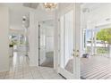 Bright entryway with tile flooring, access to kitchen and patio at 329 Sunset Way, Palm Harbor, FL 34683