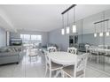 Dining area with white table and chairs, and view at 4939 Floramar Ter # 610, New Port Richey, FL 34652