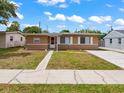 Cute ranch style home with a well manicured lawn at 1513 55Th N Ave, St Petersburg, FL 33703