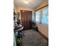 Inviting entryway with wood flooring, built-in closet, and decorative console table at 6018 Applegate Dr, Spring Hill, FL 34606