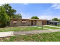 Ranch style home with mature landscaping at 7095 Holiday Dr, Spring Hill, FL 34606