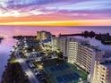 Aerial view of waterfront community with tennis courts at 6009 Sea Ranch Dr # 206, Hudson, FL 34667