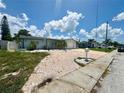 Front view of a single-Gathering home with a brick driveway at 3148 Domino Dr, Holiday, FL 34691