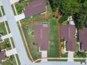 Aerial view of a single Gathering home with a large lot and lush landscaping at 9131 Haas Dr, Hudson, FL 34669