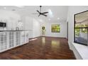 Bright living room with hardwood floors and access to the deck at 8134 Gulf Way, Hudson, FL 34667