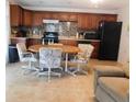 Cozy kitchen with wood cabinets and tile flooring at 10526 Mira Vista Dr, Port Richey, FL 34668