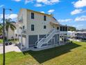 Two-story waterfront home with a large screened porch and private dock at 6530 Driftwood Dr, Hudson, FL 34667