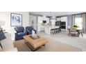 Open concept kitchen with white cabinets, stainless steel appliances, and an island at 8731 Starry Night Ter, Parrish, FL 34219