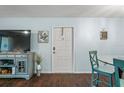 Entryway with a white door and teal colored accents at 3232 Lake Pine E Way # H2, Tarpon Springs, FL 34688