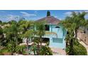 Luxury waterfront home with pool and lush landscaping at 4260 Columbus Dr, Hernando Beach, FL 34607