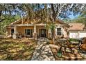 House exterior with porch and landscaping at 11193 Baltimore St, Weeki Wachee, FL 34614