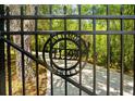 Ornate metal entrance gate with address at 11193 Baltimore St, Weeki Wachee, FL 34614