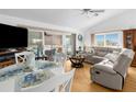 Spacious living room with light flooring and comfy seating at 6412 Yvette Dr, Hudson, FL 34667