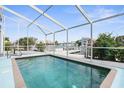 Inviting screened pool with water views at 6412 Yvette Dr, Hudson, FL 34667