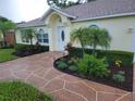 House exterior showcasing a meticulously maintained front yard at 6075 Shingler Ave, Spring Hill, FL 34608