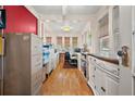 Bright office space with hardwood floors, ample storage, and natural light from multiple windows at 1501 28Th N Ave, St Petersburg, FL 33704