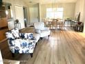 Living room with light flooring, comfortable seating, and dining area at 7278 Scotland Cir, Weeki Wachee, FL 34613