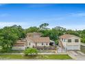 Aerial view of a charming house with a large backyard and detached garage at 1501 28Th N Ave, St Petersburg, FL 33704