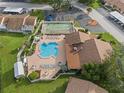 Community pool and shuffleboard from above at 3849 Staysail Ln, Holiday, FL 34691